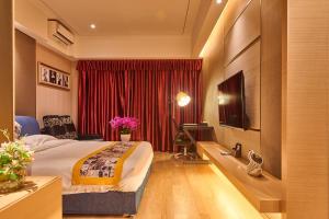 Heefun International Apartment - Zhujiang New Town FuLi Brand New World Plaza客房内的一张或多张床位