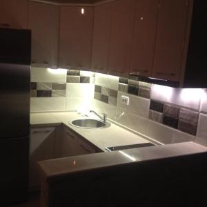 a kitchen with a sink and a counter top at Apartment Vila Mirela in Krimovice +53 photos