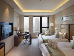 TV a/nebo společenská místnost v ubytování Kunshan Jinling Hotel