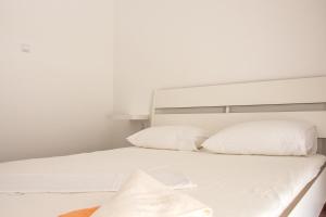 Postel nebo postele na pokoji v ubytování Rezidencija AB