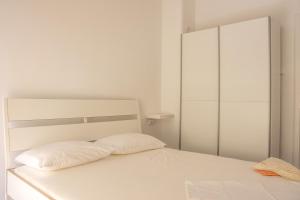 Postel nebo postele na pokoji v ubytování Rezidencija AB