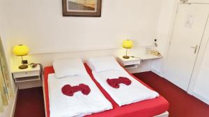 Łóżko lub łóżka w pokoju w obiekcie Hotel de Kroon