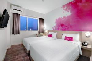 Postel nebo postele na pokoji v ubytování favehotel S. Parman Medan + 16 fotografií