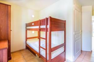 Voodi või voodid majutusasutuse Residence Le Parc d'Arradoy - maeva Home toas