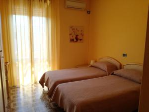 מיטה או מיטות בחדר ב-Bellerive Ristorante Albergo