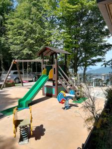 a playground with a slide and a slideintend at Baita Carla in Brunate