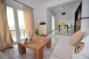 A seating area at Christina Apartment