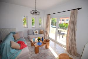 A seating area at Christina Apartment