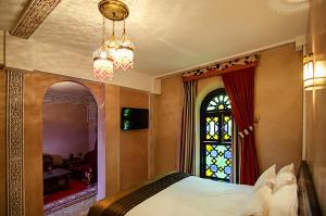Postel nebo postele na pokoji v ubytování Palais Ommeyad Suites & Spa