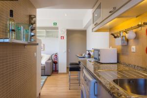 Virtuvė arba virtuvėlė apgyvendinimo įstaigoje Casa do Largo