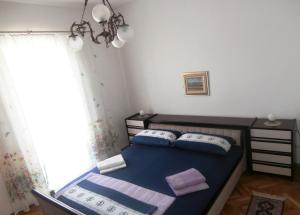 Postel nebo postele na pokoji v ubytování Panorama Postira Apartments