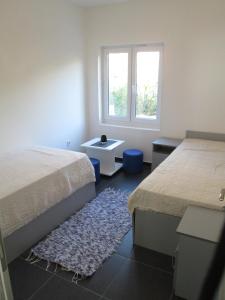 Postel nebo postele na pokoji v ubytování Apartments Stevanovic