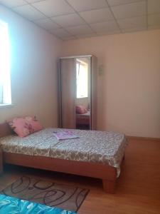 Postel nebo postele na pokoji v ubytování Hotel Uyut
