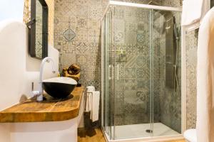 a bathroom with a sink and a shower at Jacaranda Apartments in Peniscola