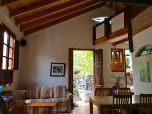 a living room with a couch and a table at Casa Ambiente in Valle Gran Rey