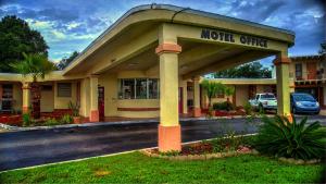 a motel office with a sign that reads motel office at Nassau Holiday Motel in Yulee