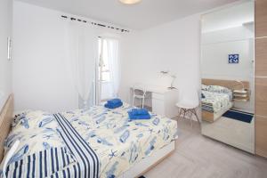 Postel nebo postele na pokoji v ubytování Apartments Tamburini
