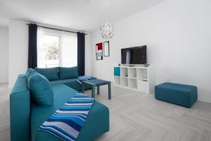 TV a/nebo společenská místnost v ubytování Apartments Tamburini