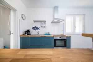 Kuchyň nebo kuchyňský kout v ubytování Apartments Tamburini