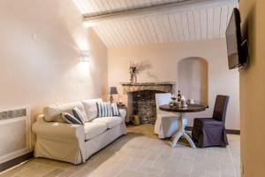 a living room with a couch and a table at Borgo San Gaetano in Bernalda