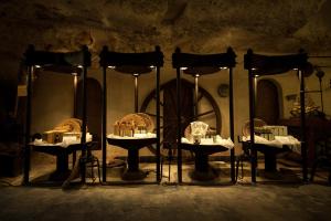 a group of tables with food on them in a room at Masseria Il Frantoio in Ostuni