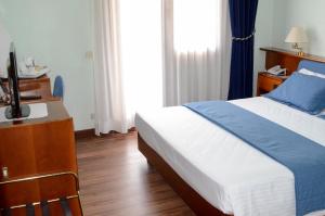 Postel nebo postele na pokoji v ubytování Hotel Bellavista