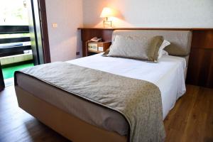 Postel nebo postele na pokoji v ubytování Hotel Bellavista