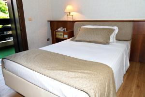 Postel nebo postele na pokoji v ubytování Hotel Bellavista