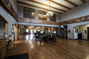 a large lobby with wooden floors and a living room at Marv Herzog Hotel in Frankenmuth