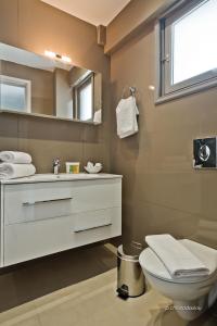 Koupelna v ubytování Nereus Luxurious Suites + 7 fotografií