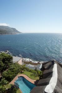 a view of a swimming pool and the ocean at A Whale of a Time in Fish Hoek