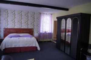Giường trong phòng chung tại Hotel Draschwitz