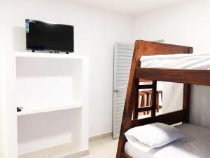 Poschodová posteľ alebo postele v izbe v ubytovaní Cabañas Aqua Blue