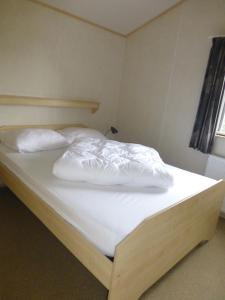 Een bed of bedden in een kamer bij Vakantieverblijf Springendalsebeek