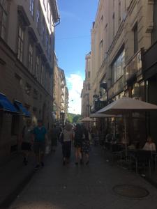 a group of people walking down a city street at Paloma Apartment in Budapest