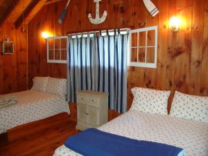 מיטה או מיטות בחדר ב-Paradise Resort Saratoga