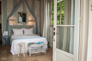Ein Bett oder Betten in einem Zimmer der Unterkunft Villa Caprichosa Boutique Hotels