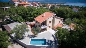 an aerial view of a house with a swimming pool at Apartments Villa Diamant with Pool & Whirlpool in Čižići