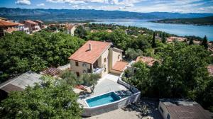 an aerial view of a house with a swimming pool at Apartments Villa Diamant with Pool & Whirlpool in Čižići