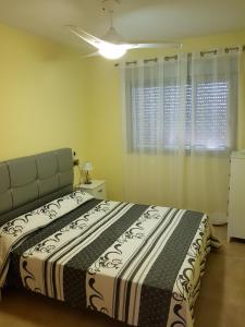 Ένα ή περισσότερα κρεβάτια σε δωμάτιο στο Salomé Beach Apartments