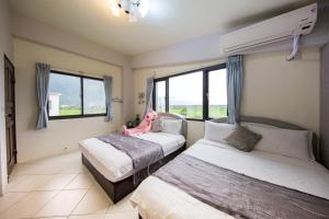 Postel nebo postele na pokoji v ubytování Slow Fly B&B