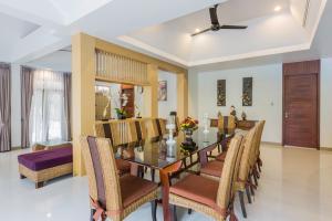 a dining room with a table and chairs at Villa Raeya in Ao Nang Beach