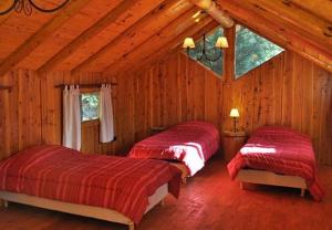 A bed or beds in a room at Costa Bonita Cabañas