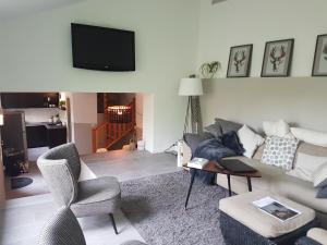 a living room with a couch and a table at les bignones in Uzès