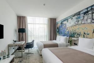Rúm í herbergi á Messier 53 Hotel Yerevan