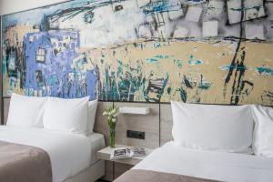 Rúm í herbergi á Messier 53 Hotel Yerevan
