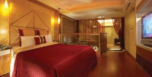 Giường trong phòng chung tại Spring Breeze Boutique Motel