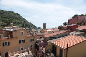 a view of a city with buildings and a mountain at Albergo Degli Amici in Monterosso al Mare