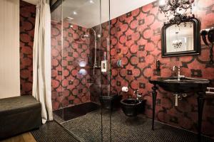 a bathroom with a shower and a sink at Teku Sardinia Boutique Hotel in Bari Sardo