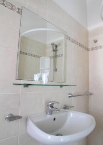 Koupelna v ubytování Hotel Universo